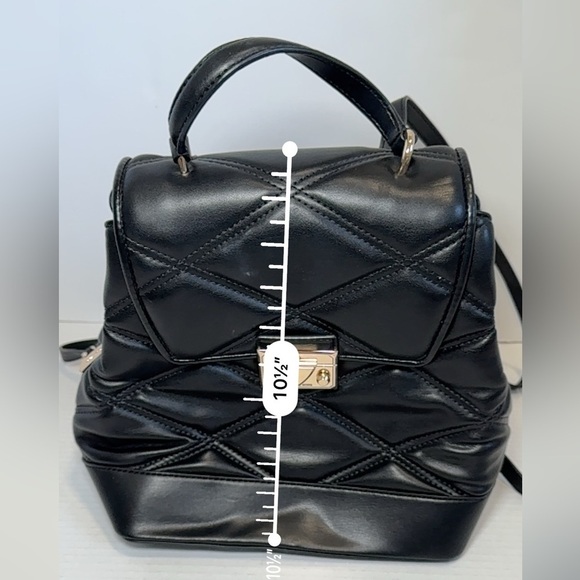 Michael Kors Serena MD Quilted Leather Flap Backpack in black.